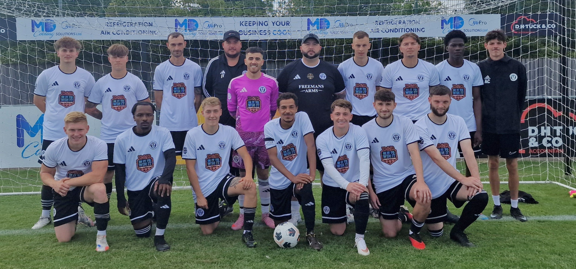 Grimsby United senior squad lined up before kick-off in club colours